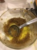 Niter Kibbeh A small glass bowl containing a few tablespoons of spiced butter (niter kibbeh), with a tablespoon in the middle, scooping some up.
